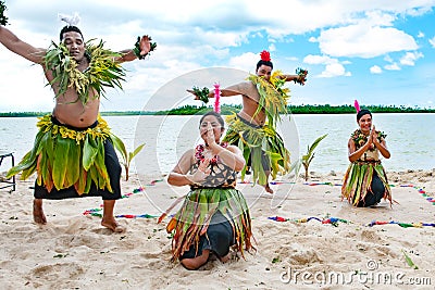 Dancers South Pacific. Young men and women dressed with typical dresses made from nature dancing traditional dances in Tonga. Editorial Stock Photo