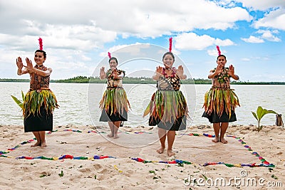 Dancers South Pacific. Young women dressed with typical dresses made from nature dancing traditional dances in Kingdom of Tonga. Editorial Stock Photo