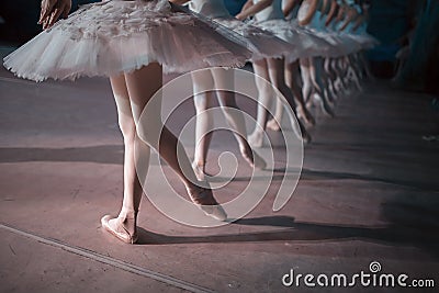 Dancers in white tutu synchronized dancing Stock Photo