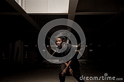 Dancing african american man in black clothes Stock Photo
