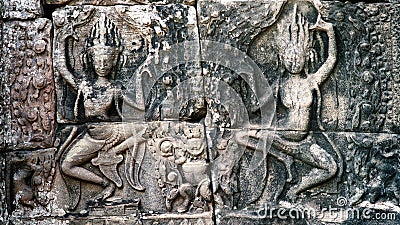 Dancing Apsaras an old Khmer art carvings Stock Photo