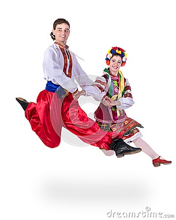 Dancing couple in polish national traditional costume jumping, full length portrait isolated Stock Photo