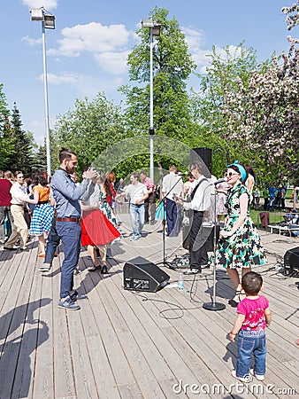 Dancing on the dance floor of Gorky Park, Moscow Editorial Stock Photo