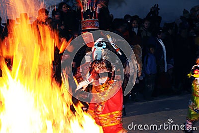 Dancing with fire and masks in the procession of the vigen del carmen in the streets at night june 2018 paucartambo cuzco Editorial Stock Photo