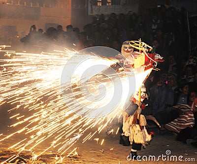 dancing devotees with fireworks and masks in the procession of la vigen del carmen in the streets at night june 2018 paucartambo Editorial Stock Photo