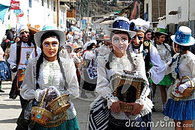 Dancing devotees with mask in the streets of the town the procession of the Virgin of Carmen -.Catholic religion Editorial Stock Photo