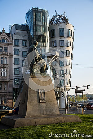 Dancing House and monument of Alois Jirasek in Prague Czech Republic Editorial Stock Photo