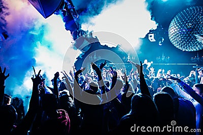 Dancing people in nighclub with Nitrogen clouds Editorial Stock Photo