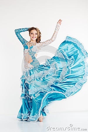 Dancing teen girl in fashion oriental dress Stock Photo