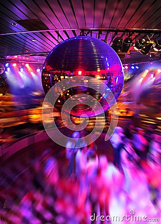 Dancing under disco mirror ball Stock Photo