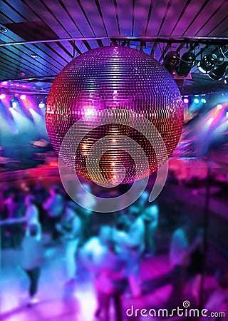 Dancing under disco mirror ball Stock Photo