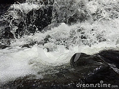 Dancing water with white foams Stock Photo