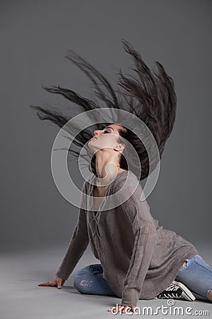 Dancing woman swinging hair Stock Photo