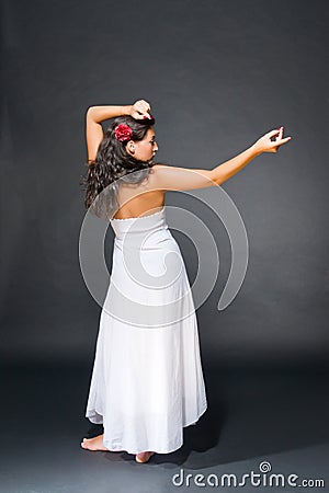 Dancing young dark haired beautiful woman Stock Photo