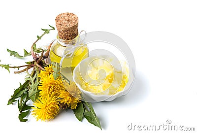 Dandelion flowers with tincture and salve Stock Photo