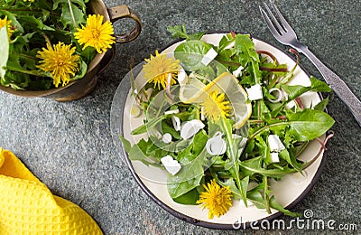 Dandelion salad with onions and cheese Stock Photo