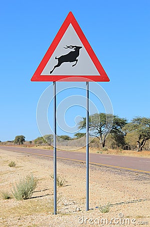 Danger, be Alert - Kudu and Wildlife Crossing Road Sign - Drivers be cautious Stock Photo