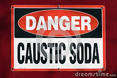 Danger Caustic Soda placard in red white and black Editorial Stock Photo