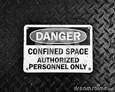 Danger Confined Space Authorized Personnel Only Sign in Gritty Black and White Stock Photo