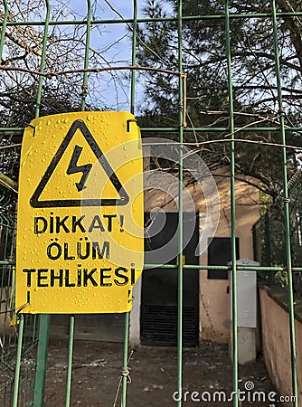 Danger of death sign on fence in Turkish Stock Photo