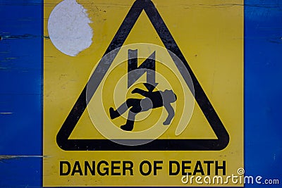 Danger of Death sign with man struck by lightning Editorial Stock Photo