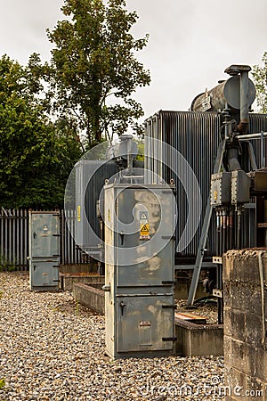 Danger of Death warning triangle with Electricity symbol on transformers at substation. Norfolk, UK - August 5th 2020 Editorial Stock Photo