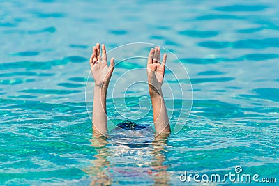 Danger games at sea. Child drowns Stock Photo