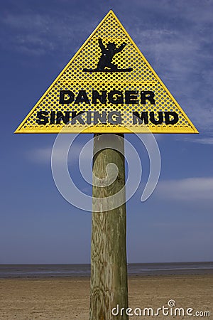 Danger sinking mud sign, sand point beach England uk Stock Photo