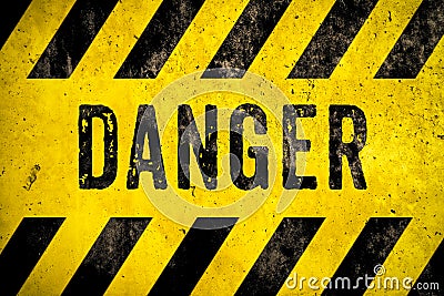 DANGER warning sign word text yellow black stripes concrete wall cement texture background. Danger dangerous warning Stock Photo