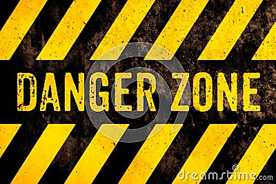 Danger zone warning sign text with yellow and black stripes painted over concrete wall surface facade cement texture background Stock Photo