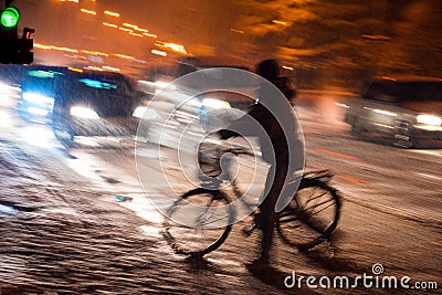 Dangerous city traffic situation with cyclist and car in the cit Stock Photo