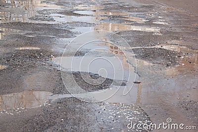 Dangerous destroyed roadbed. The bad asphalted road. Stock Photo