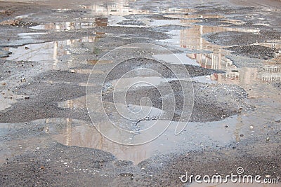 Dangerous destroyed roadbed. The bad asphalted road. Stock Photo