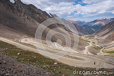 Dangerous gravel mountain road to Kumtor gold mine. Serpentine road to Barskoon mountain pass. Travel, tourism in Kyrgyzstan Stock Photo