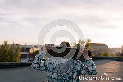 Dangerous hobby. Skateboarder with skateboard Stock Photo