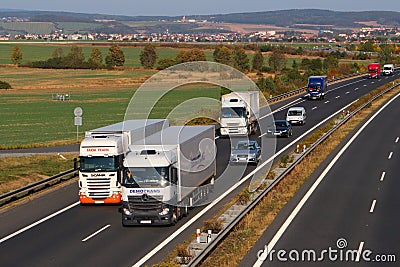 Dangerous overtaking of two trucks Editorial Stock Photo