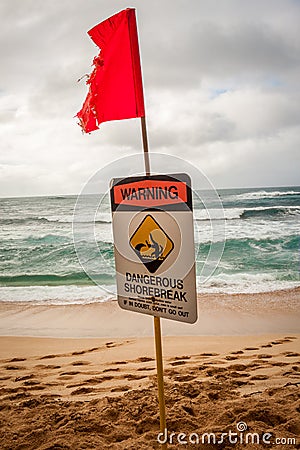 Dangerous shore break sign at Sunset Beach Stock Photo