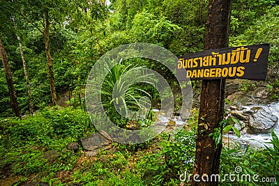 Dangerous sign over waterfall background Stock Photo