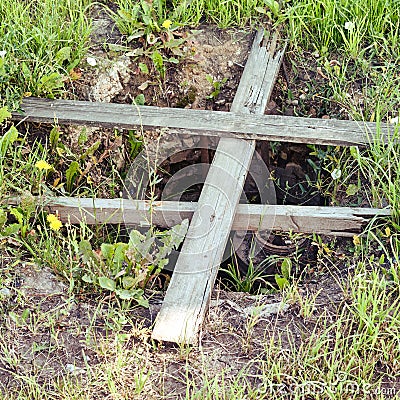 Dangerous well closed with old boards. Violation of safety regulations with an open hatch Stock Photo