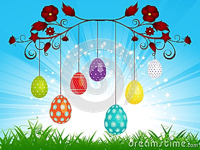 Dangling Easter eggs on blue sky landscape Stock Photo