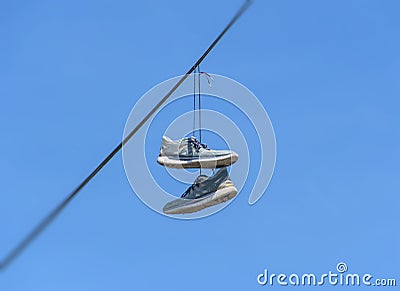 Dangling Shoes Stock Photo