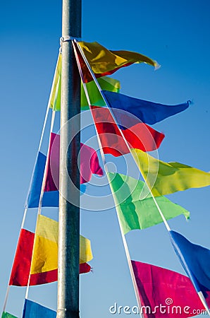 Dangling in the wind holiday flags Stock Photo