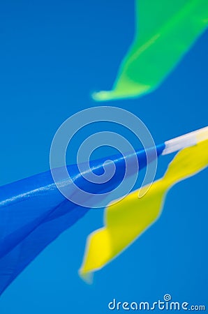 Dangling in the wind holiday flags Stock Photo