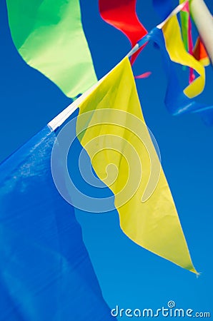 Dangling in the wind holiday flags Stock Photo