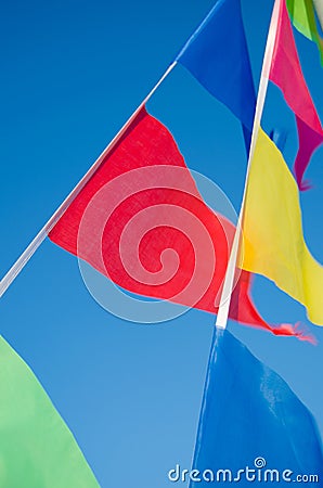 Dangling in the wind holiday flags Stock Photo