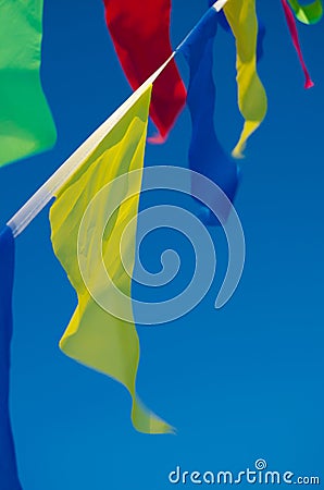 Dangling in the wind holiday flags Stock Photo