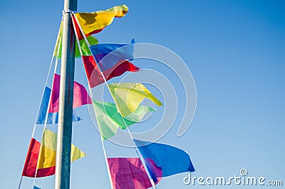 Dangling in the wind holiday flags Stock Photo