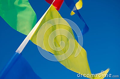 Dangling in the wind holiday flags Stock Photo