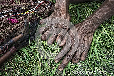 In the Dani tribe older women often cut their fingers when relatives die to show their love for them Stock Photo