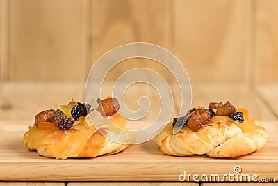 Danish custard with mixed dried fruit on wooden dish Stock Photo